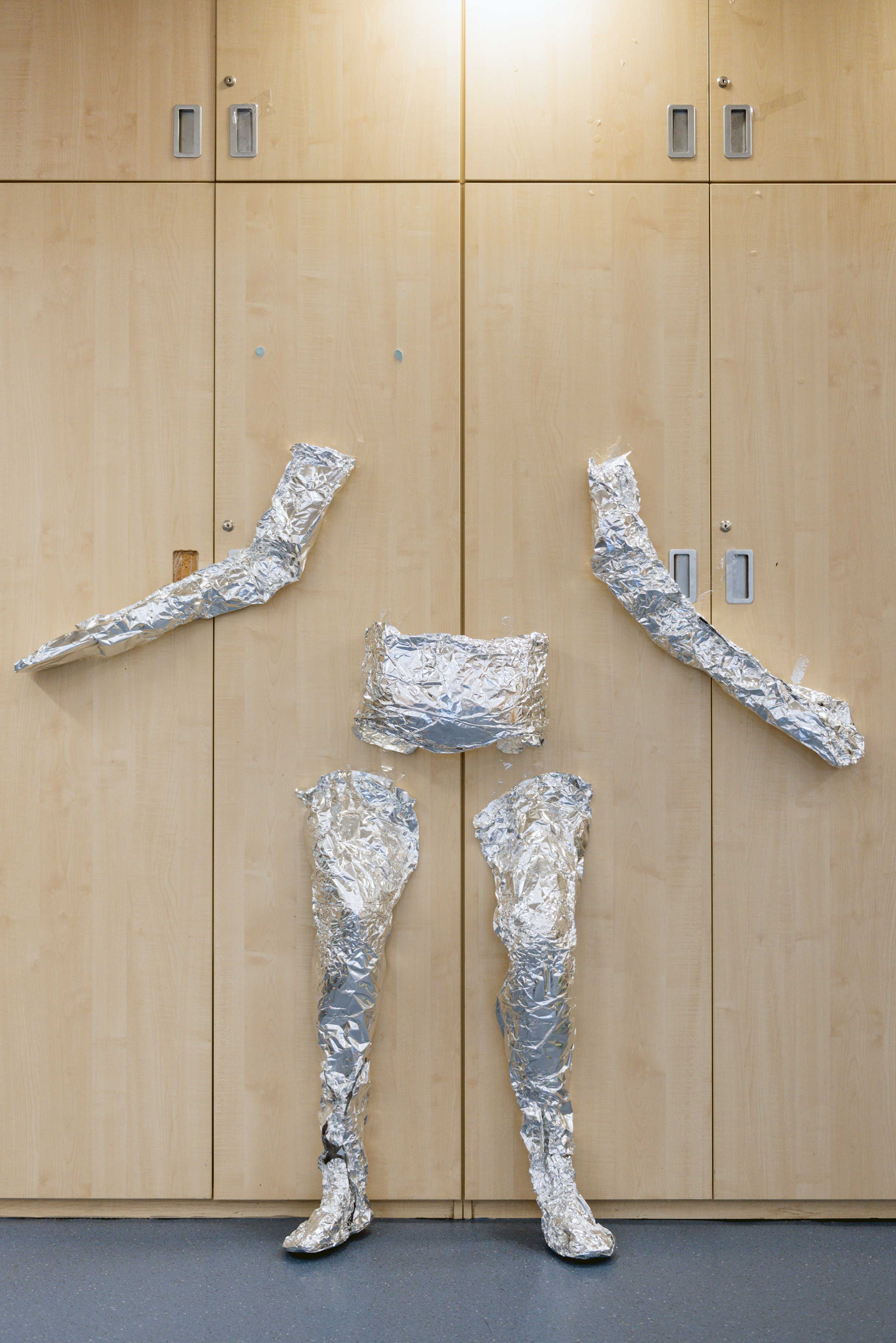 A life sized cast of a body made of foil