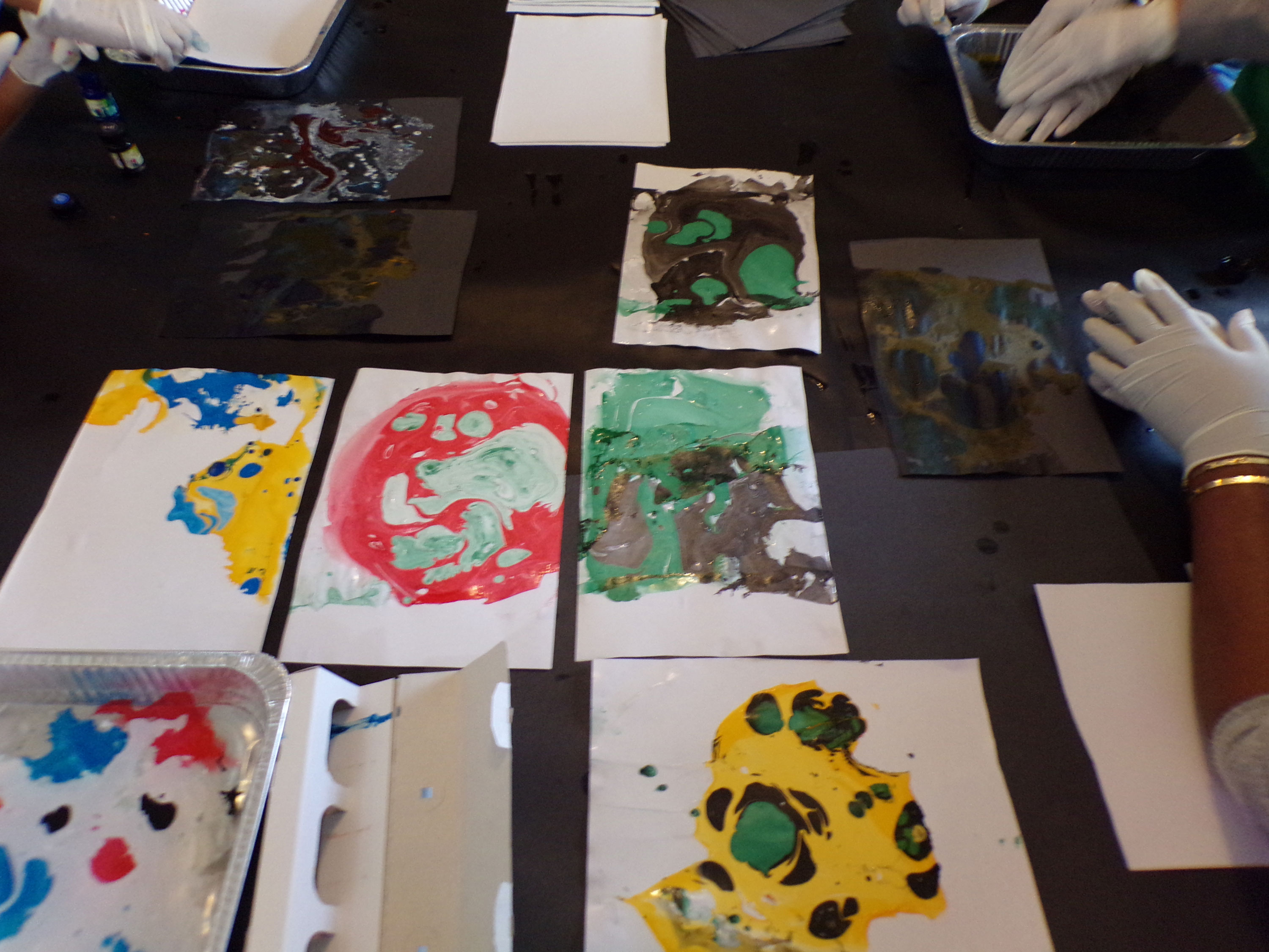 A collection of colourful marbling paper created by the young people